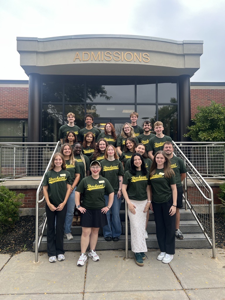 group of ambassadors in front of a sign that says BPORT