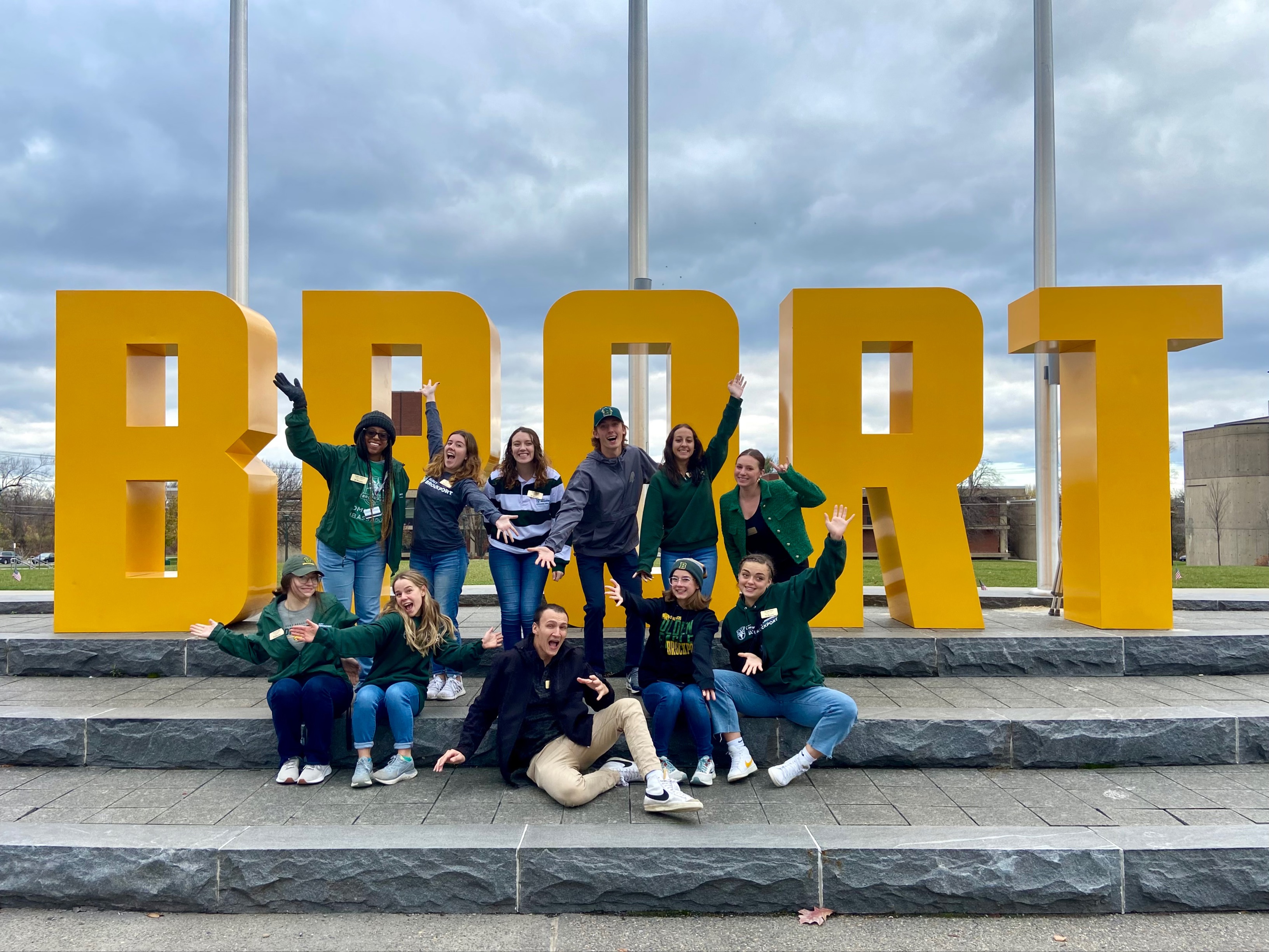 group of ambassadors in front of a sign that says BPORT