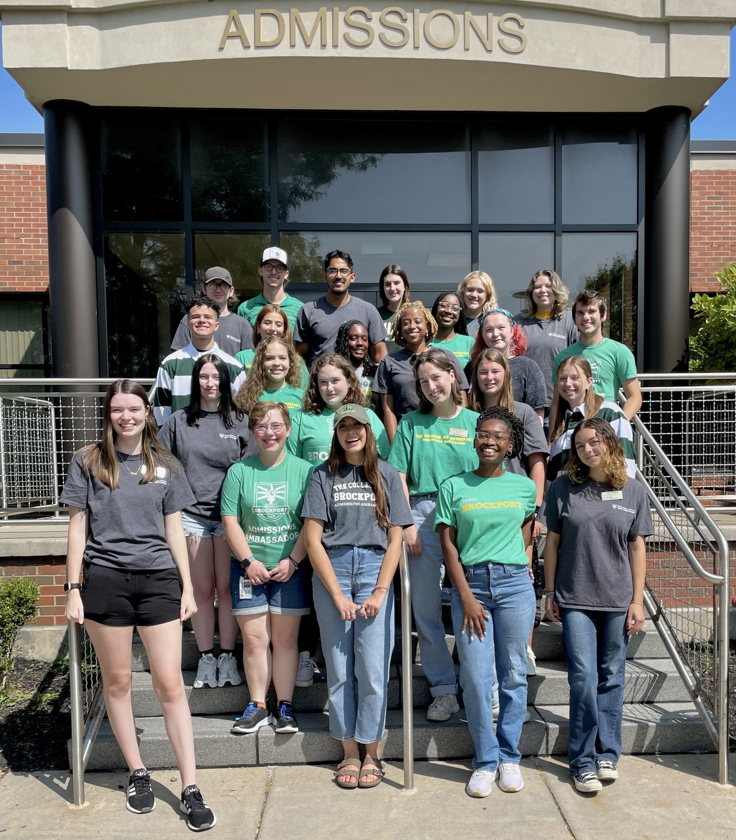 group of ambassadors in front of a sign that says BPORT